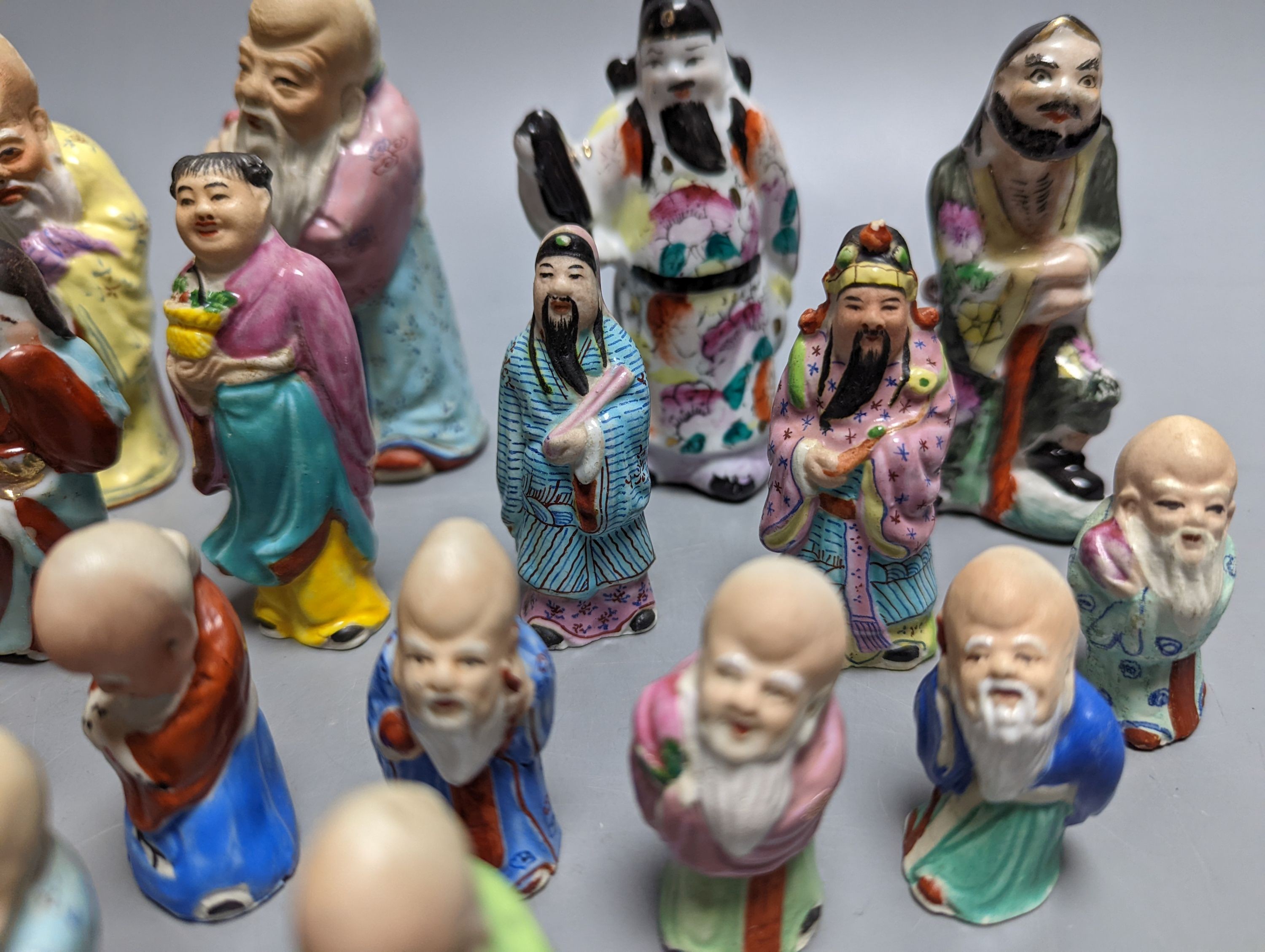 A collection of Chinese enamelled porcelain miniature figurines, including a 19th century Chinese sancai enamelled biscuit figure of a beast, 9cm